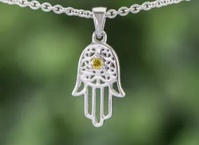 Die Hand der Hamsa mit gelbem Diamanten